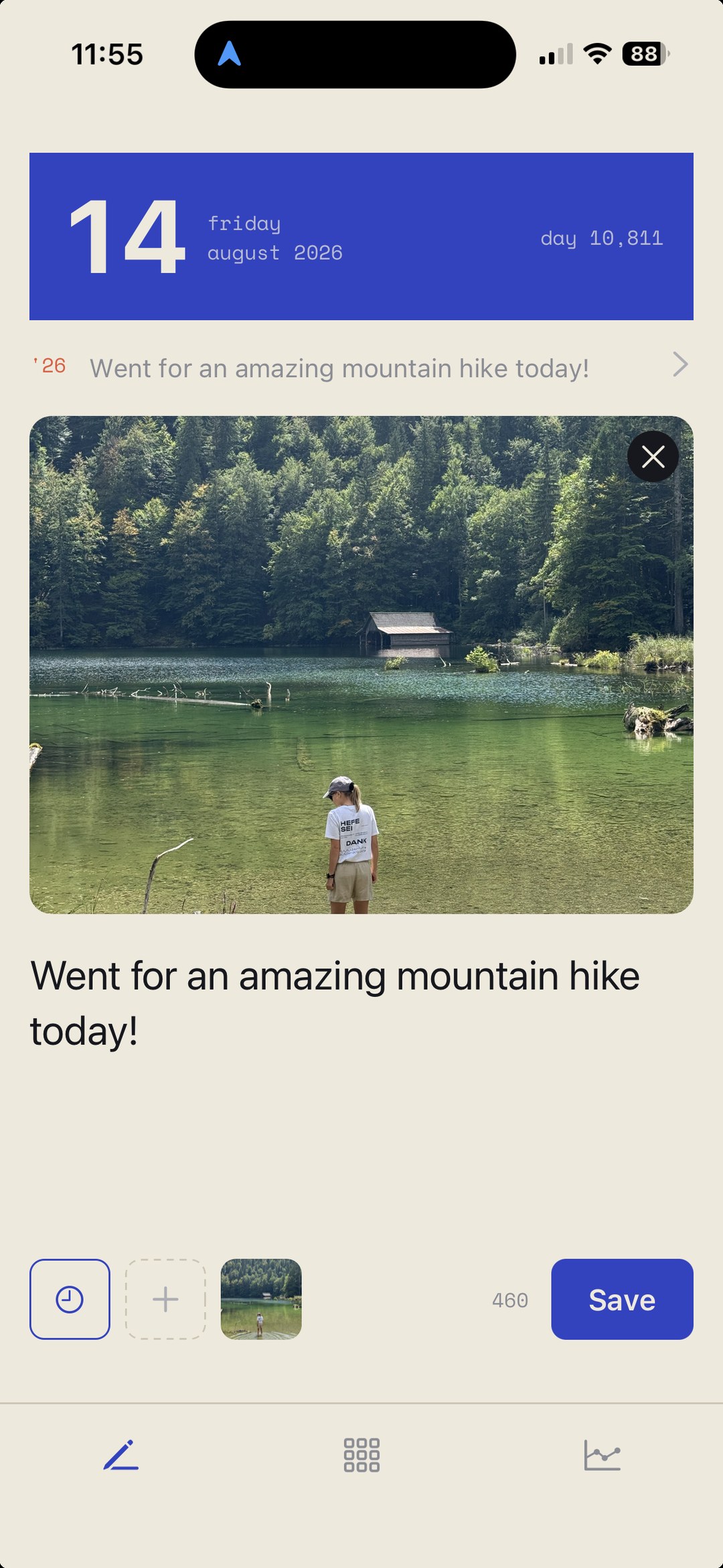 Onsen entry screen with a single sentence about a mountain hike and an attached photo of a lake